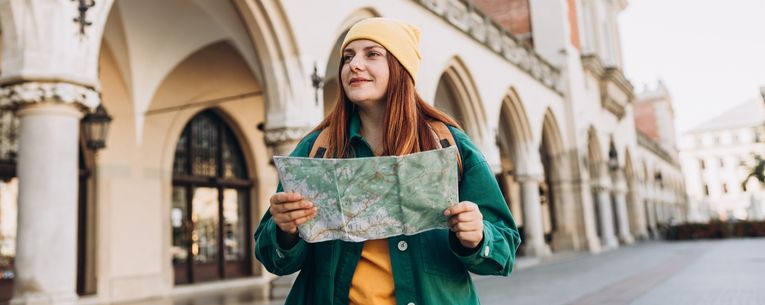 Allianz - traveler with map in Krakow