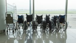 row of wheelchairs at airport