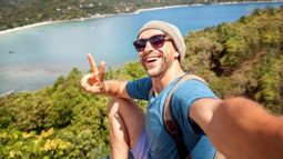 young traveler taking selfie