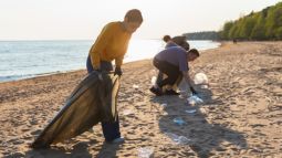 picking up garbage from beach