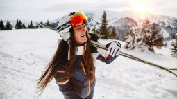 woman with skis on ski vacation