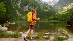 traveler hiking by a lake