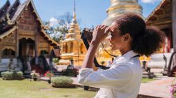 young traveler with camera in thailand