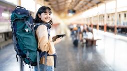 backpacking traveler waiting on train