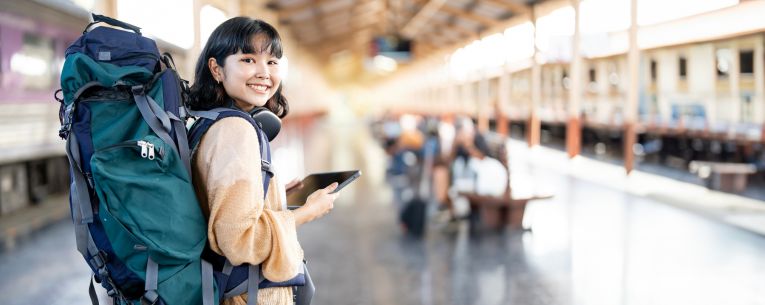 Allianz - backpacking traveler waiting on train